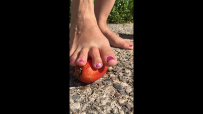 Foot Caressing A Tomato
