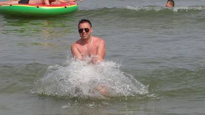 Handsome Guy In The Sea With Splashing Waves