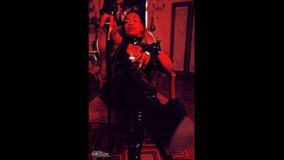 Ebony Domina In Latex Bending Over In Catsuit