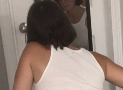 Backside View-Squatting In Skinny Jeans, White Tank And Cowgirl Boots With Red Thong Sticking Out