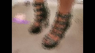 Pedicured Toes In Buckled High-Heeled Shoes