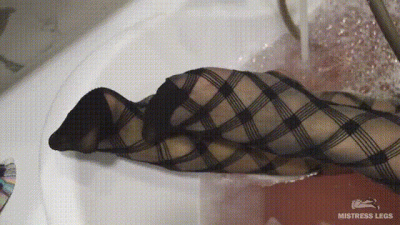 Wet Legs In Black Fishnet Tights In Bath