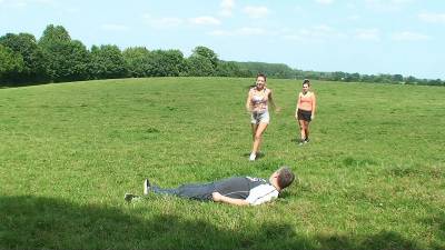 2 Girls Jumping On Their Slave In A Field