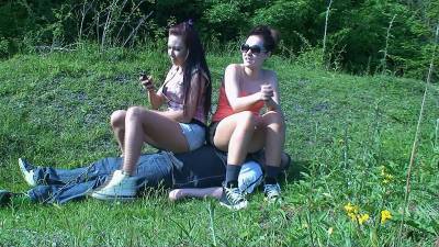 2 Girls Sit On The Slave In A Field