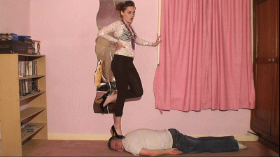 Sophie Teases Her Slave Whilst Stepping On His Head