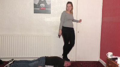 Standing On His Head In Her Boots Whilst Smoking A Cigarette