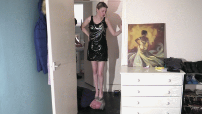 Chelsea Head Trample In A Black Sequin Dress & Silver High Heels