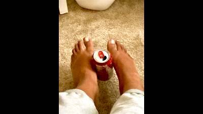 Big Feet Picking Up A Can
