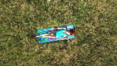 Beautiful Girl Sunbathing In A Swimsuit