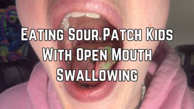 Eating And Swallowing Sour Candy With Mouth Open