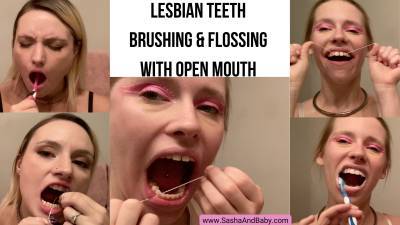 Lesbian Teeth Brushing And Flossing With Open Mouth