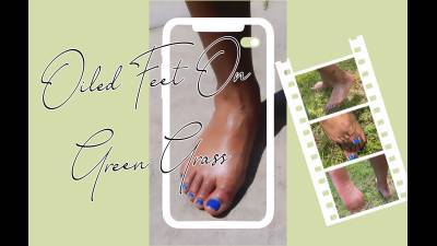 Oiled Feet On Green Grass