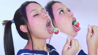 Sucking A Lolipop Making Silly Faces