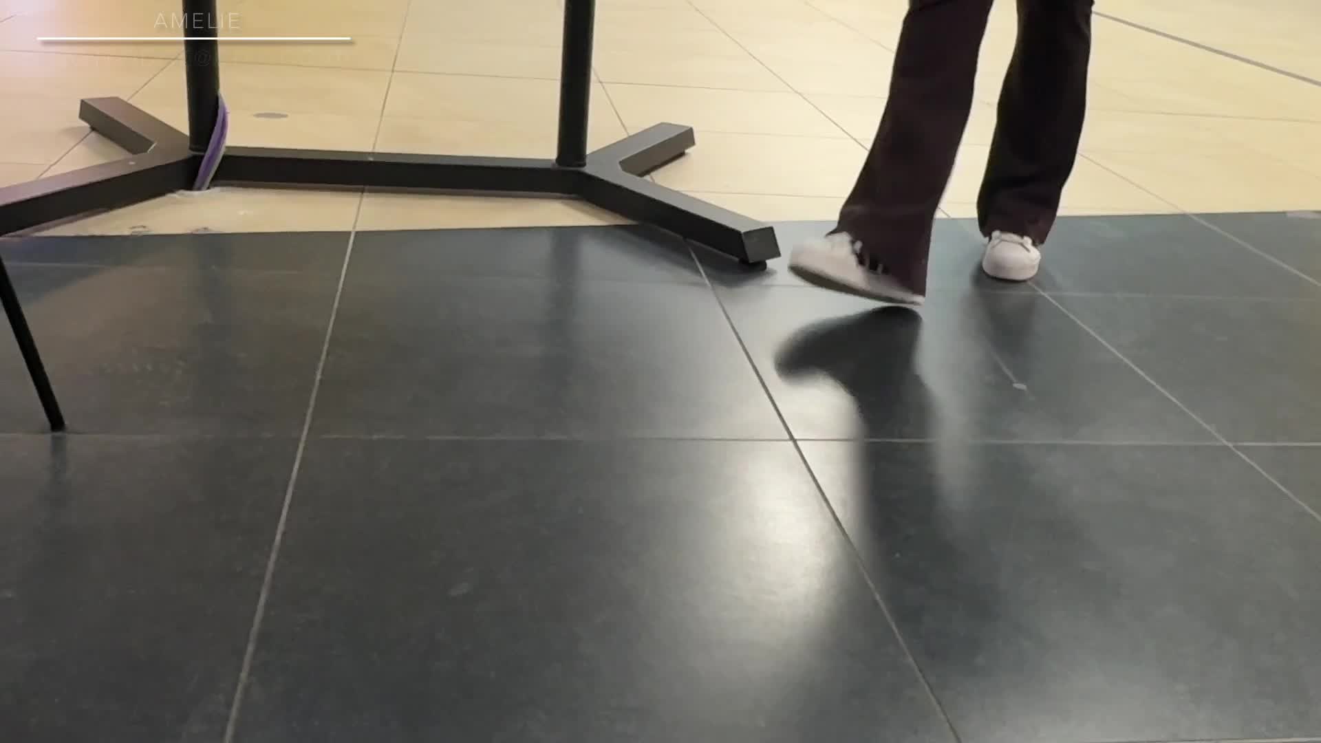 Candid Shoeplay And Dangling In Adidas Sneakers And Nike White Socks At The Airport