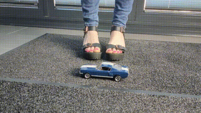 Abby Giantess Toy Car Crush 1968 Shelby Boss Mustang In Black Platform High Heels Low Side View