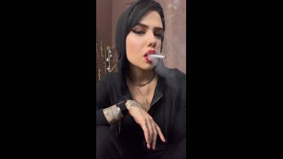 Smoking Instructions, Encouragement, Closeup In A Hooded Jumpsuit
