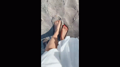 Playful Feet In The Sand