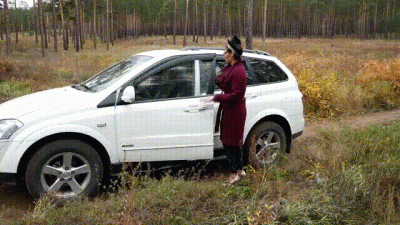 A Beautiful Girl In High Heels Got Stuck In The Mud With Her Car And Pedal Pumping