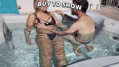 A Couple Is Petting In An Outdoor Bathtub