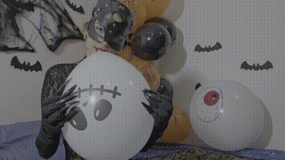 The Cat Woman On Halloween Bursts Balloons With Her Claws