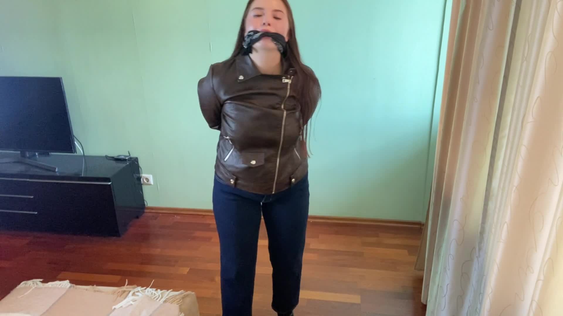 Gagged Girl In Brown Leather Jacket