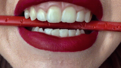 Rebecca Noir Biting-Red-Pencil-Close-Up