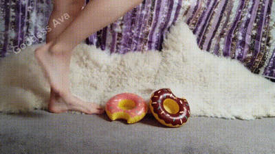 Barefoot Beauty Stomps And Deflates Inflatable Donuts With Sensual Soles