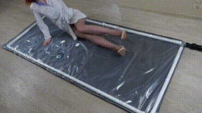 Physician In A Polyethylene Vacuum Bed With Myostimulation