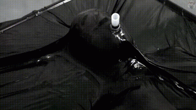 Rope Bondage In A Black Vacuum Bed