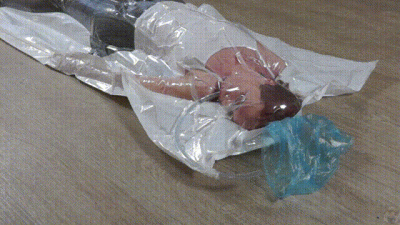 Girl In Vacuum Bag Plays With Breathing