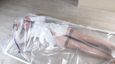 Nurse In A Polyethylene Vacuum Bed