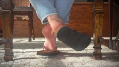 Unaware Foot Play Under Table With Flip Flops