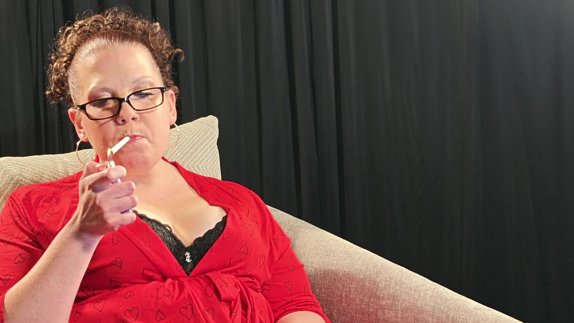 Sitting In A Red Robe And Black Lacy Bra Smoking