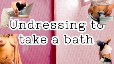 Undressing To Take A Bath