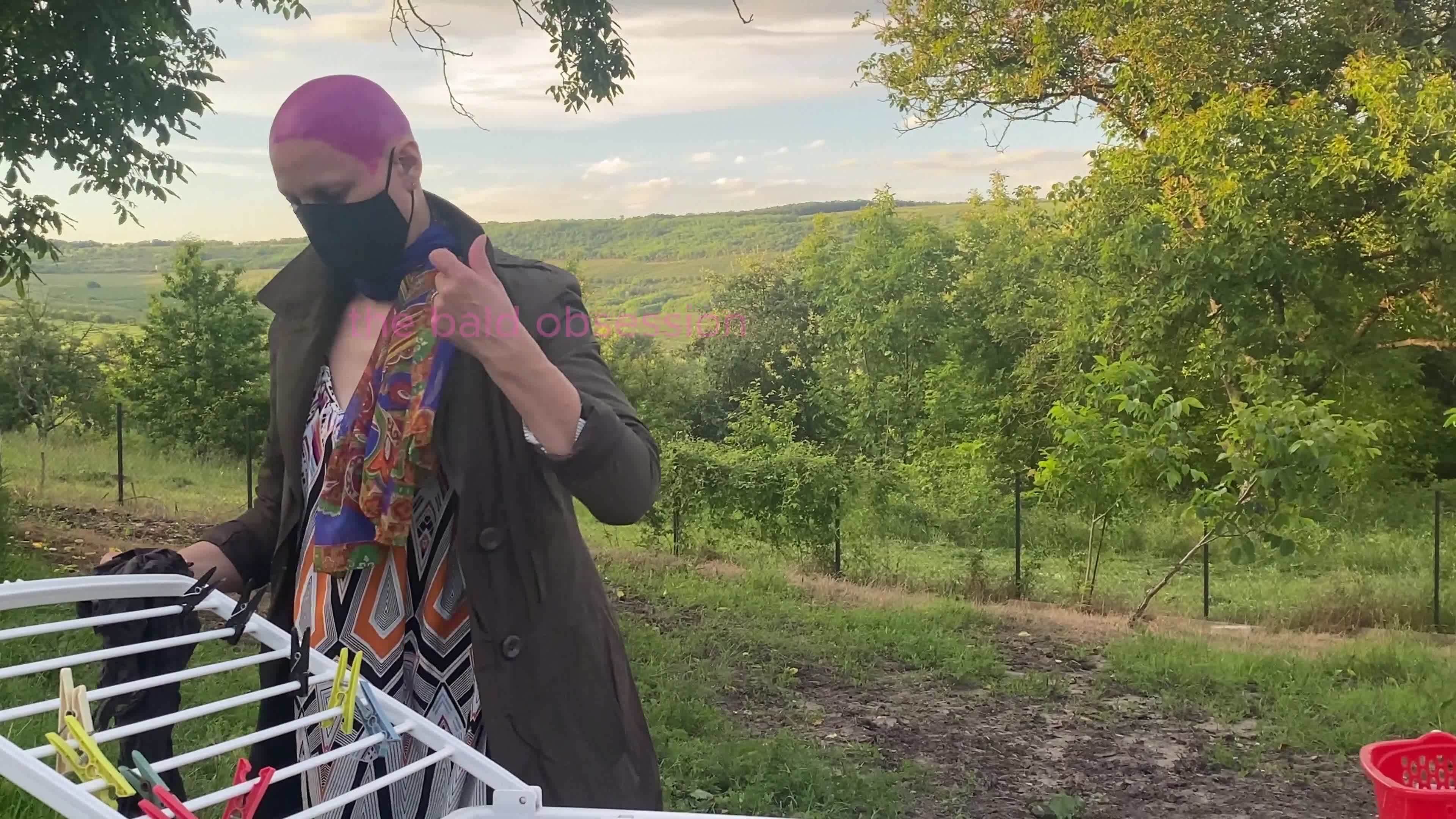 How About "Laundry In Style: The Charm Of Fuchsia Shave While Hanging Clothes"?