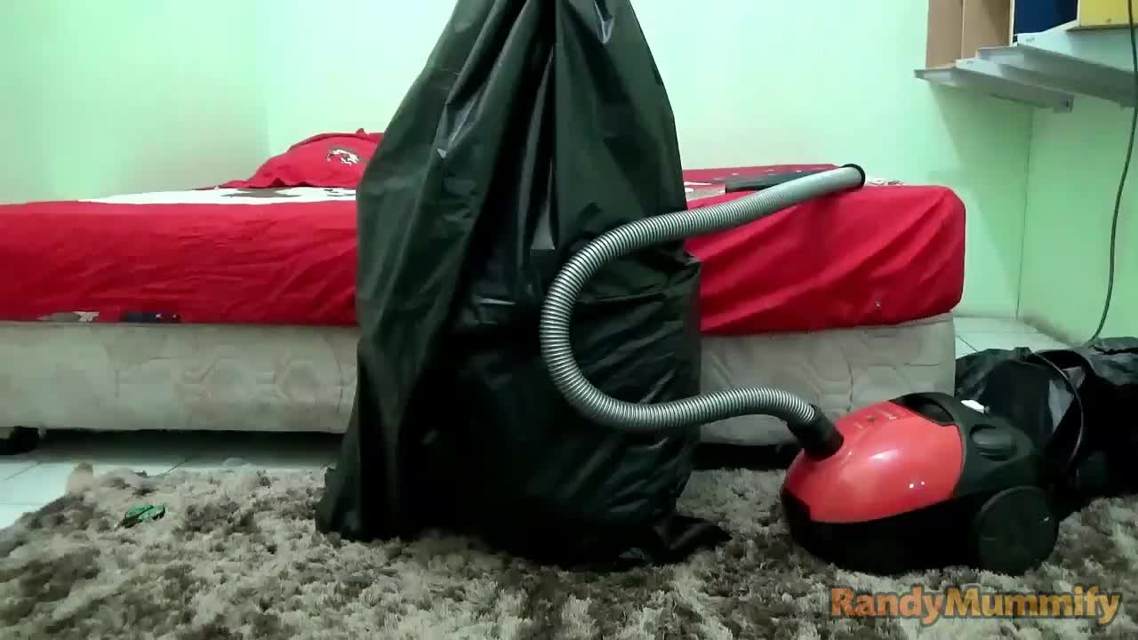 A Girl Is Vacuumed In Black Trash Plastic So She Can't Breathe