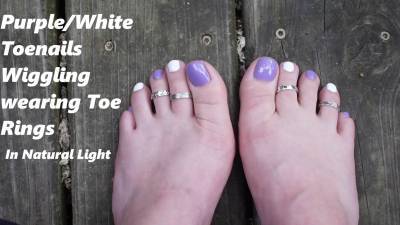 Purple And White Toes Wiggling Wearing Toe Rings