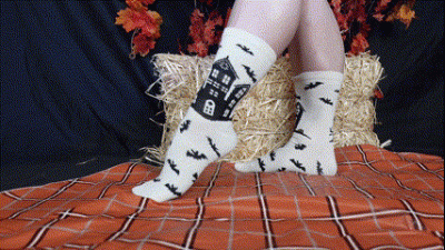 Muscular Calves In White And Black Haunted House Socks