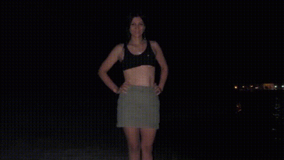 A Slender Brunette On The Shore Of A Night City Fucks A Pussy With A Fist