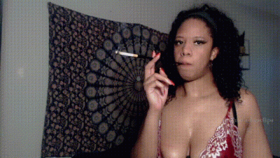 Smoking In Red Lingerie With A Cigarette Holder