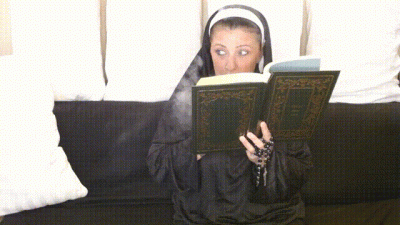 Naughty Nun Smokes A Cigarette Behind Her Bible In Church