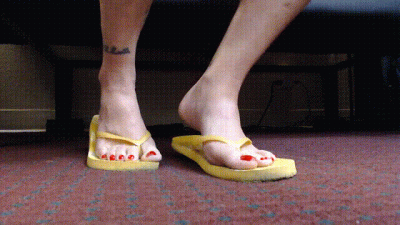 Red Toenail Wiggling Yellow Flipflops