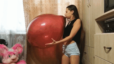 Self-Made Blowing To Pop Two Big Balloons
