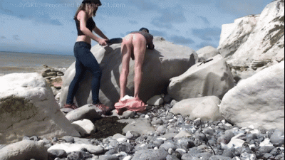 Spanking Slave On Beach