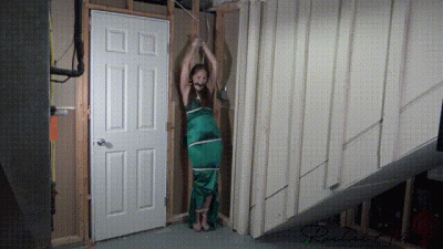 Bound In A Green Gown With Hands Overhead