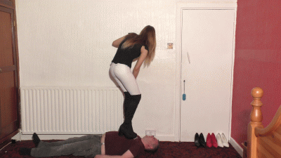 Sophie's Tight White Pants & Massive Boots Dancing On Her Slaves Body Whilst Smoking A Cigarette