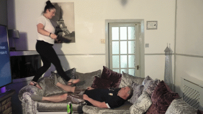 Natalia Tramples And Stomps All Over Her Slave On The Couch With Her Flat Sandals