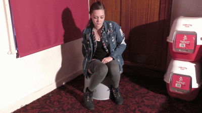 Hot Girl In Grey Leggings & Black Boots Weeing In A Jug On The Portable Toilet