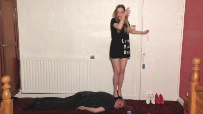 Sophie Smoking A Cigarette Whilst Dancing On The Side Of Her Slaves Face In High Heels & A Little Black Dress