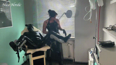 The Dominatrix In A Rubber Apron And The Rubber Pig In The Pain Clinic